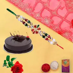 Yummy chocolaty cake and rose with free Rakhi roli...