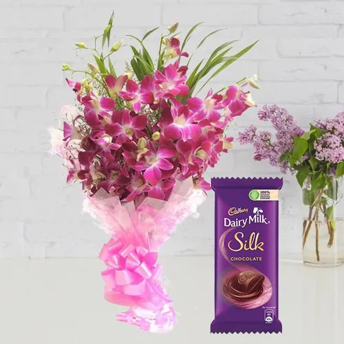 Send Bouquet of Orchids and Cadbury Dairy Milk Silk