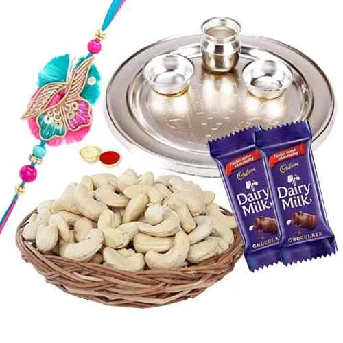 Admirable Rakhi Special Gift of One Silver Puja Thali with One Fancy Rakhi and Spicy Cashew Nuts