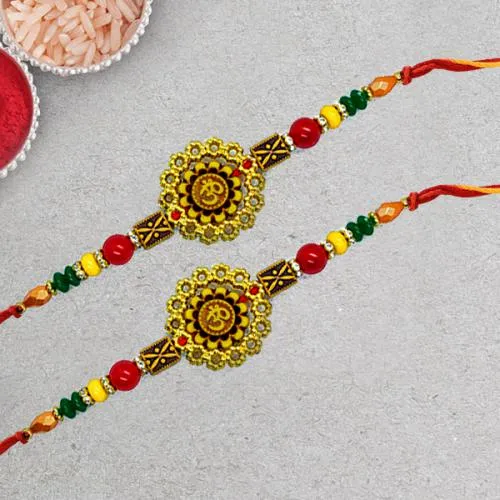 Charming Om Rakhi Pair with Roli Chawal Tika n Rakhi Card