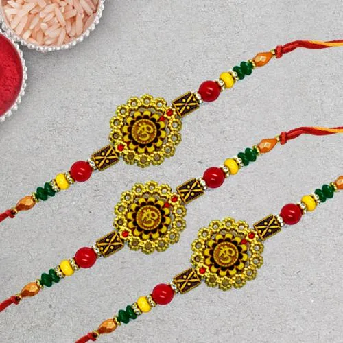 Graceful Three Om Rakhi Set with Roli Chawal Tika n Rakhi Card