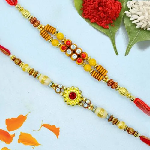 Dashing Pair of Fancy Rakhi with Roli, Chawal n Card