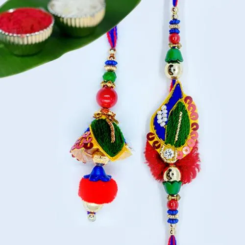 Delightful Bhaiya Bhabhi Rakhi with Roli, Chawal Tika n Card